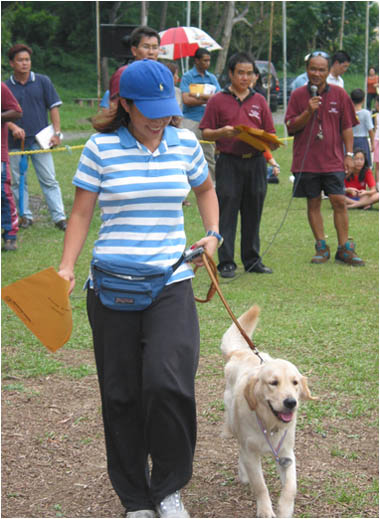 Jenn & Brinkley collecting her medal and certificate